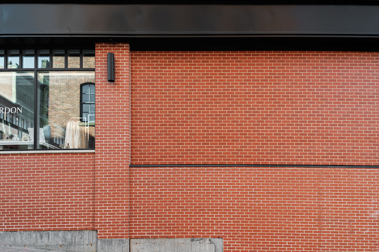 Exterior view of a building featuring Nichiha fiber cement panels and modern design