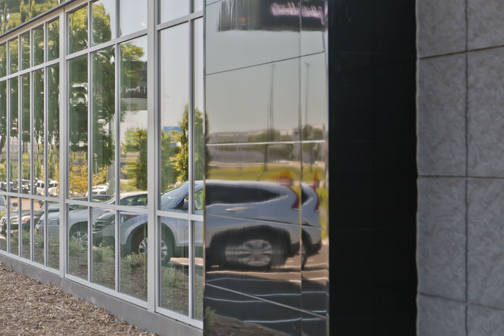 High gloss Miraia Onyx panels showing reflections of cars