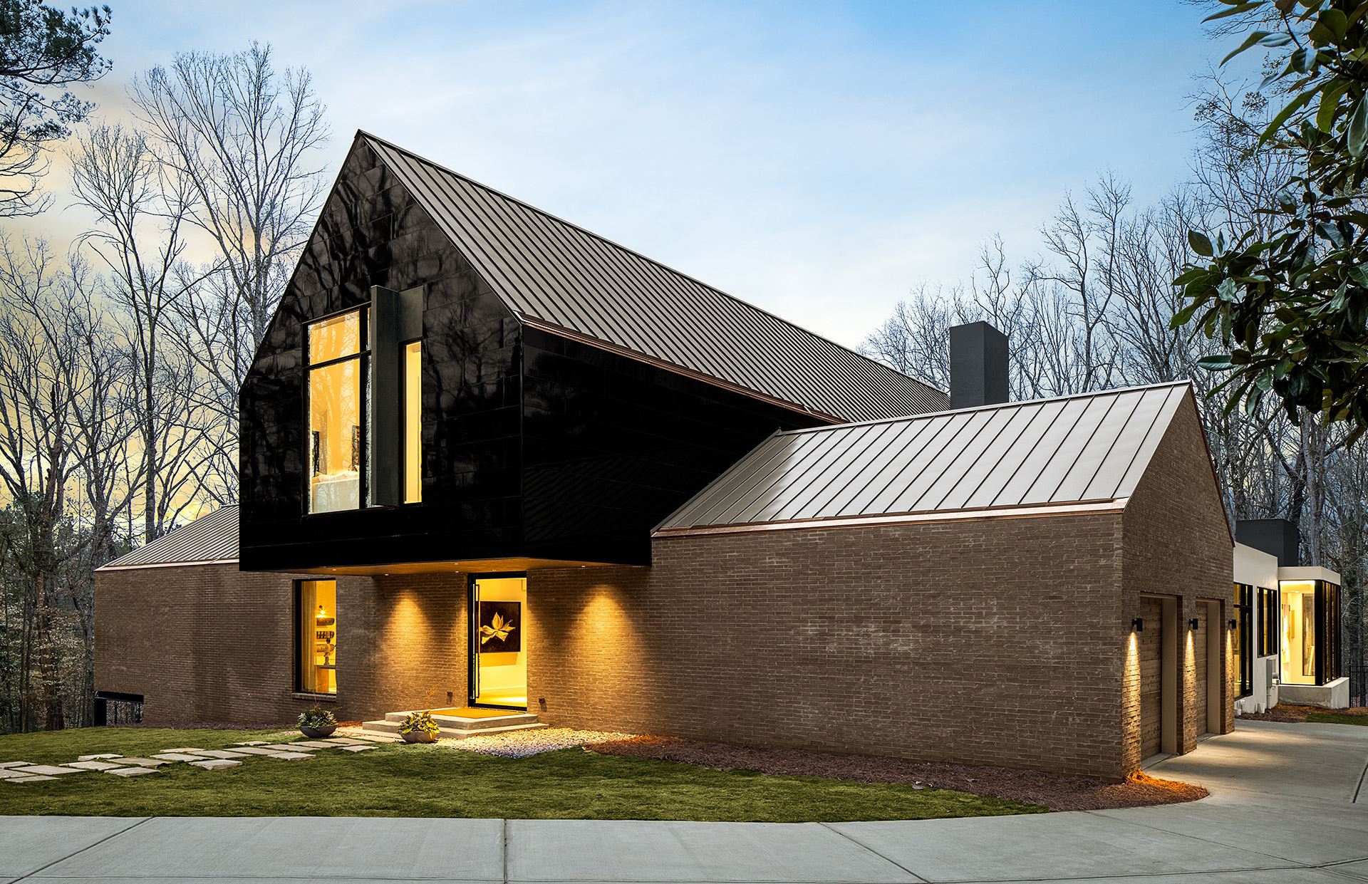 ASO house at dusk featuring Miraia panels in Onyx