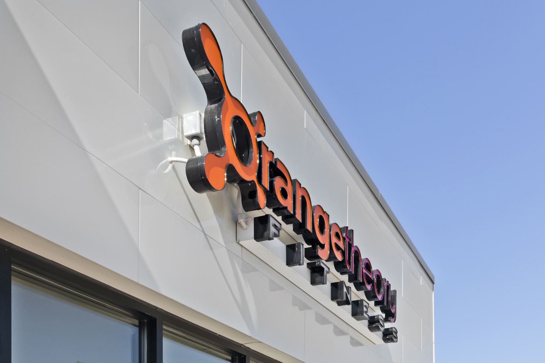 Orange Theory sign with Miraia panels in Snow