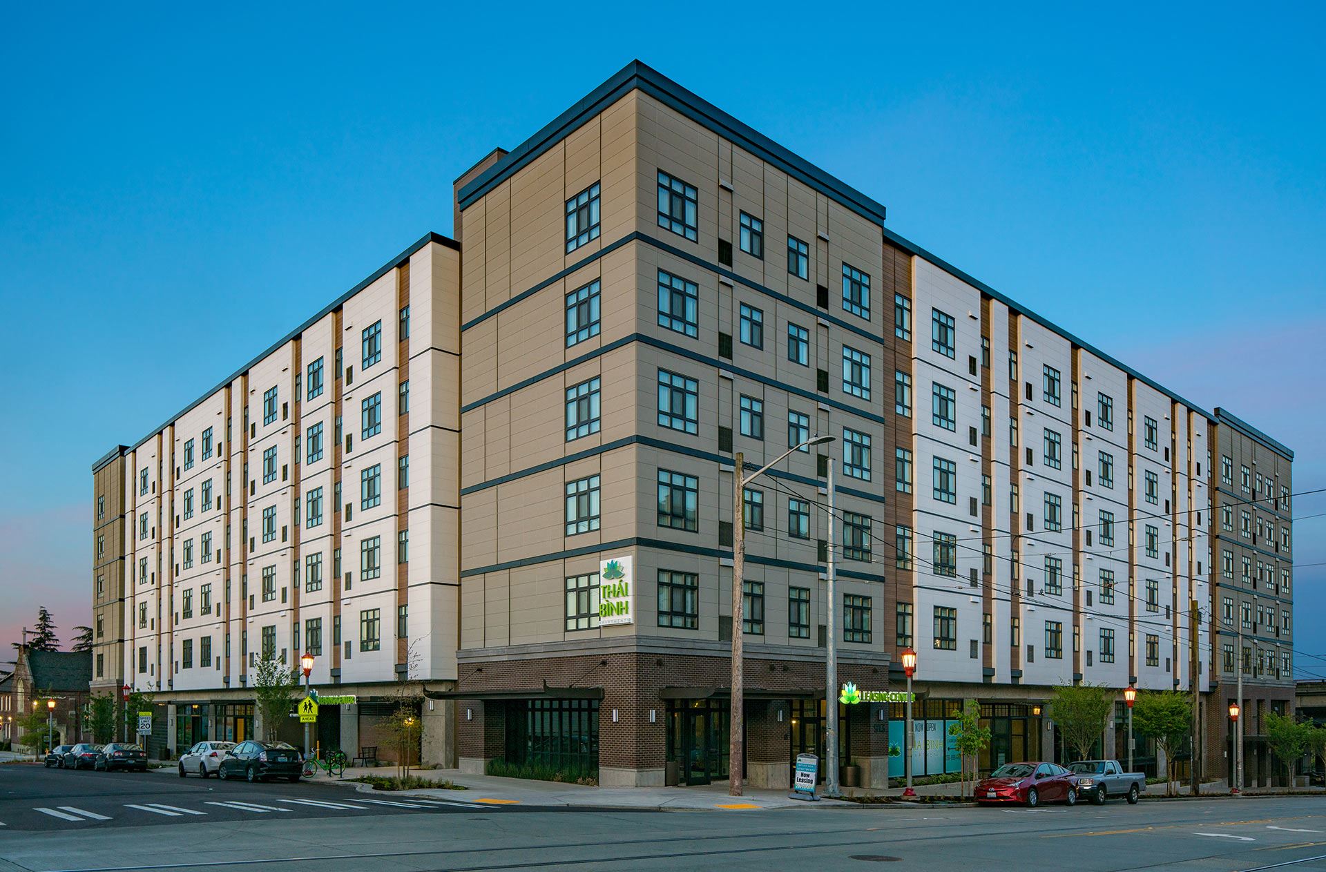 View of Thai Binh Apartments at dusk shot from the corner of the street
