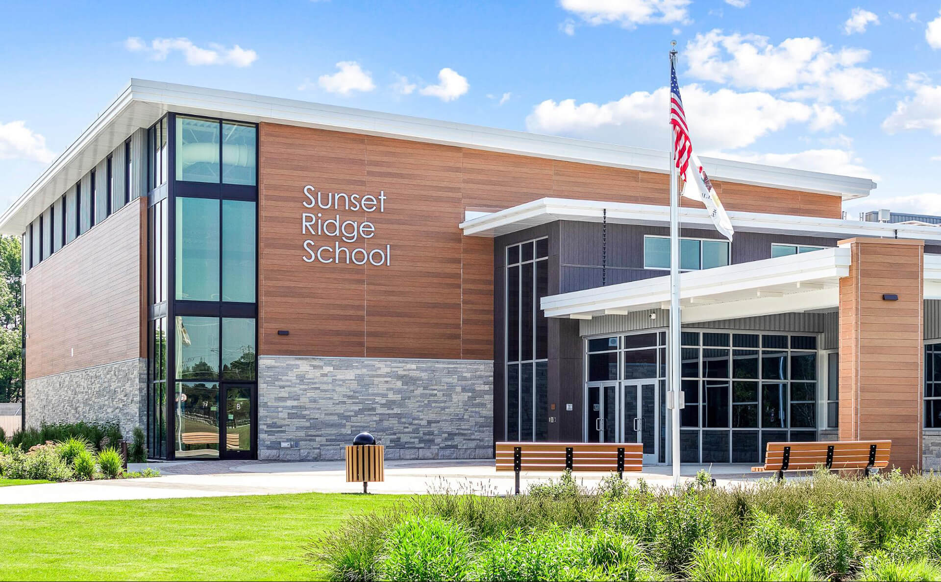 Exterior view of a building featuring Nichiha fiber cement panels and modern design