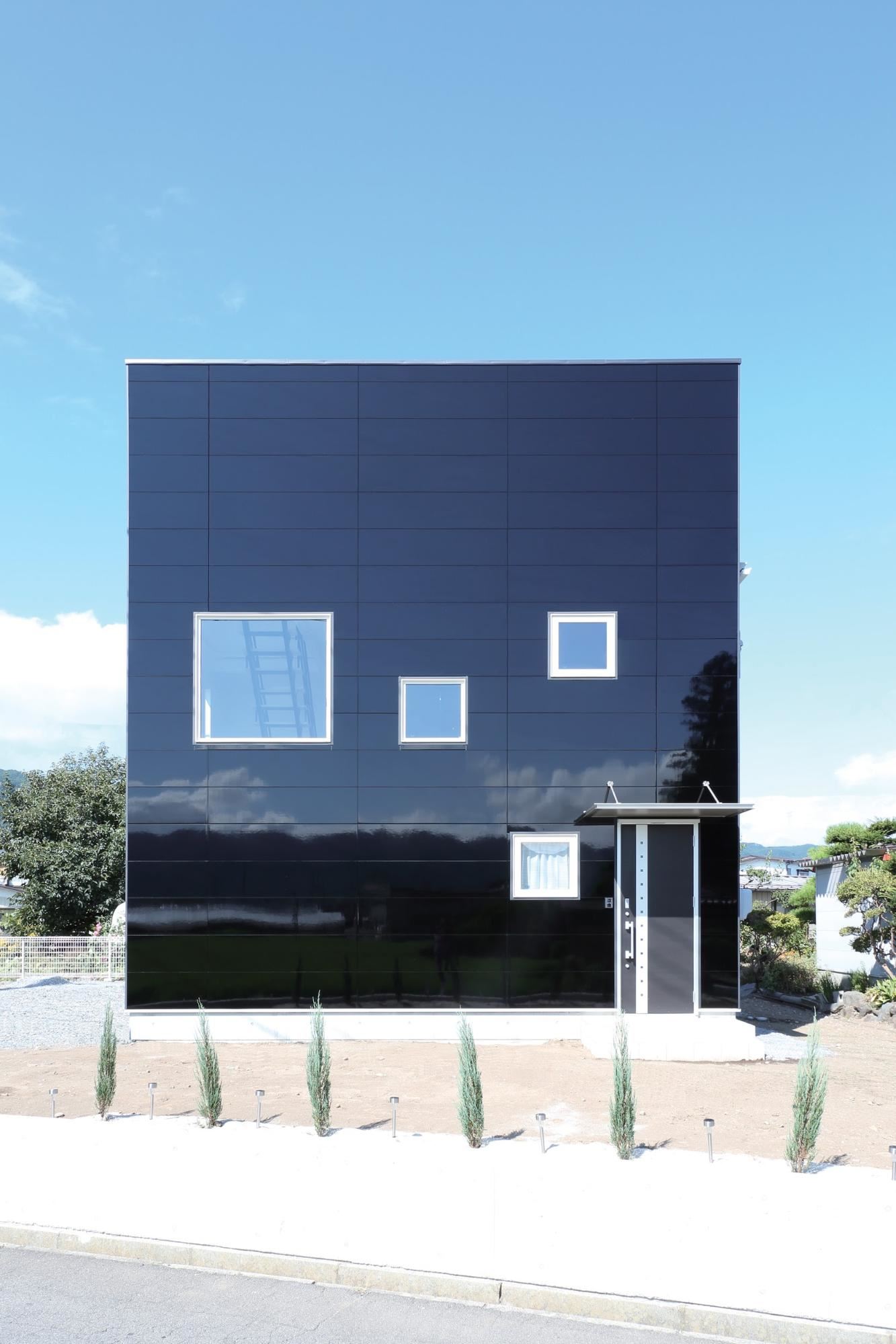 Exterior view of a building featuring Nichiha fiber cement panels and modern design