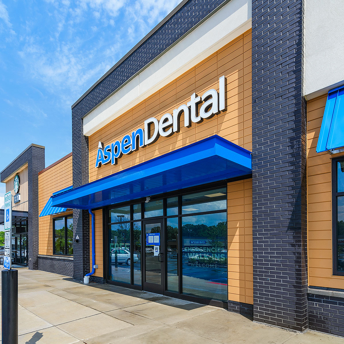 Front of Aspen Dental building with Novenary panels in Ochre
